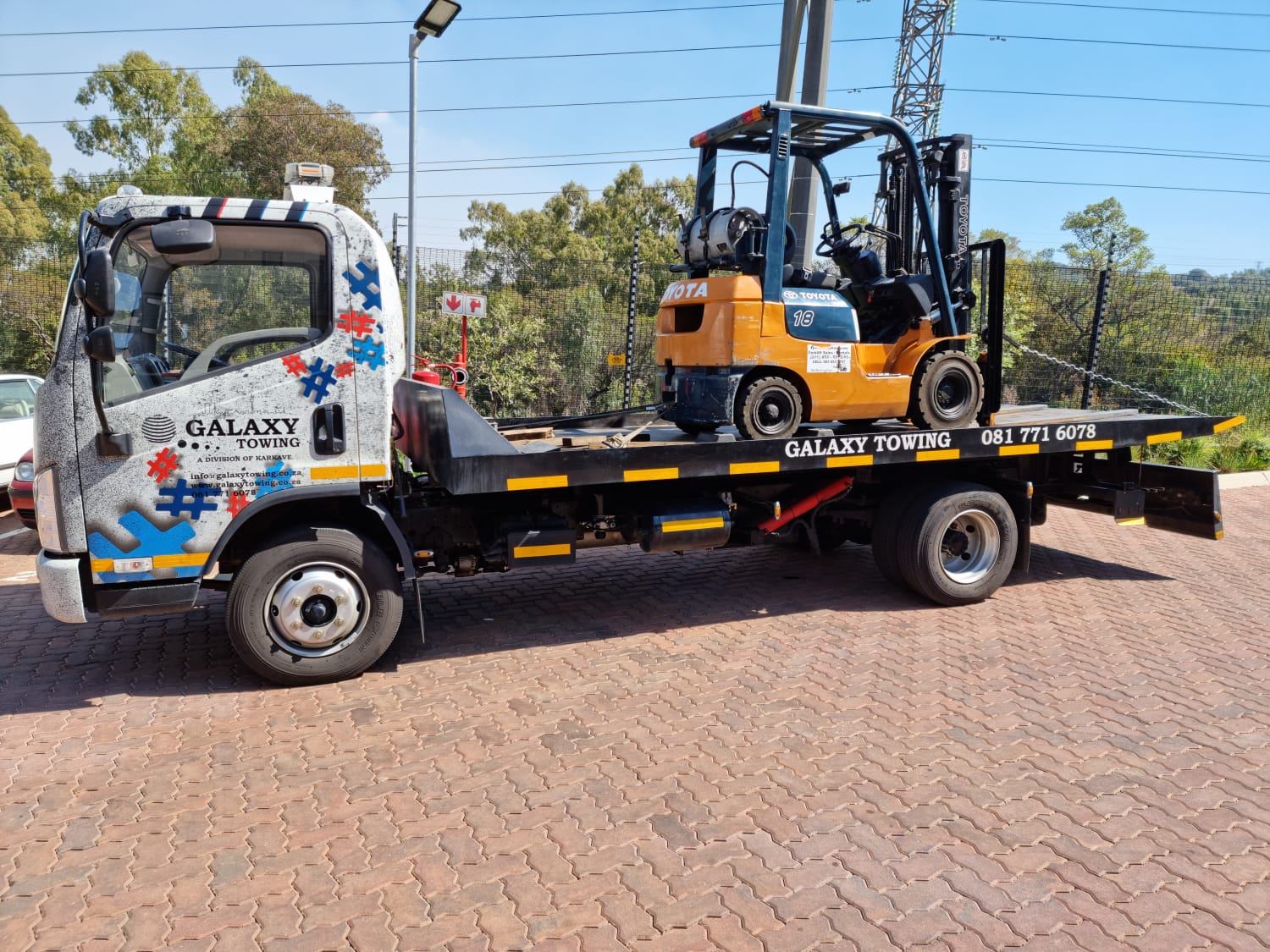 Galaxy Towing flatbed loaded with a Range Rover