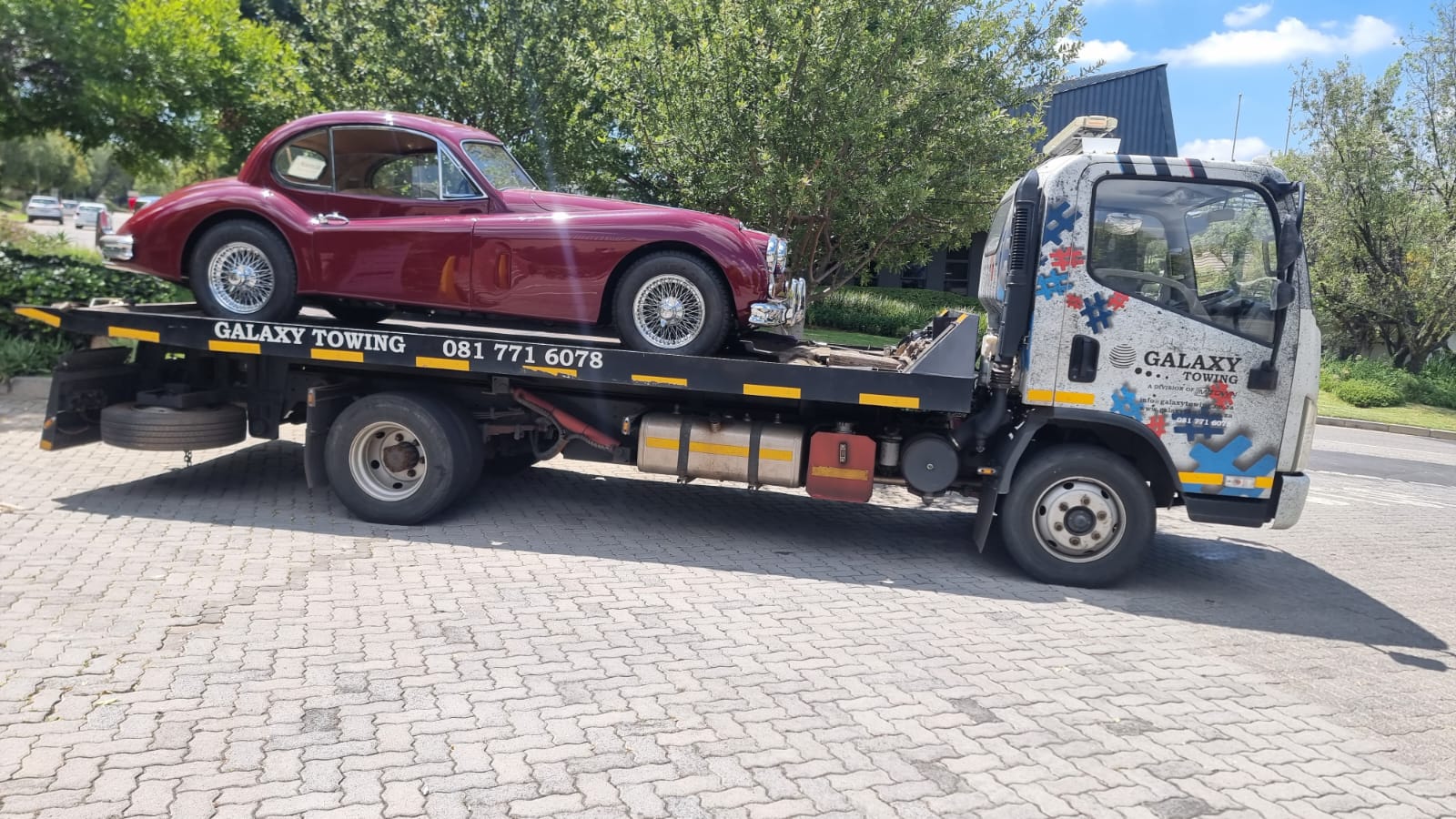 Galaxy Towing carrying a classic Jaguar sports car