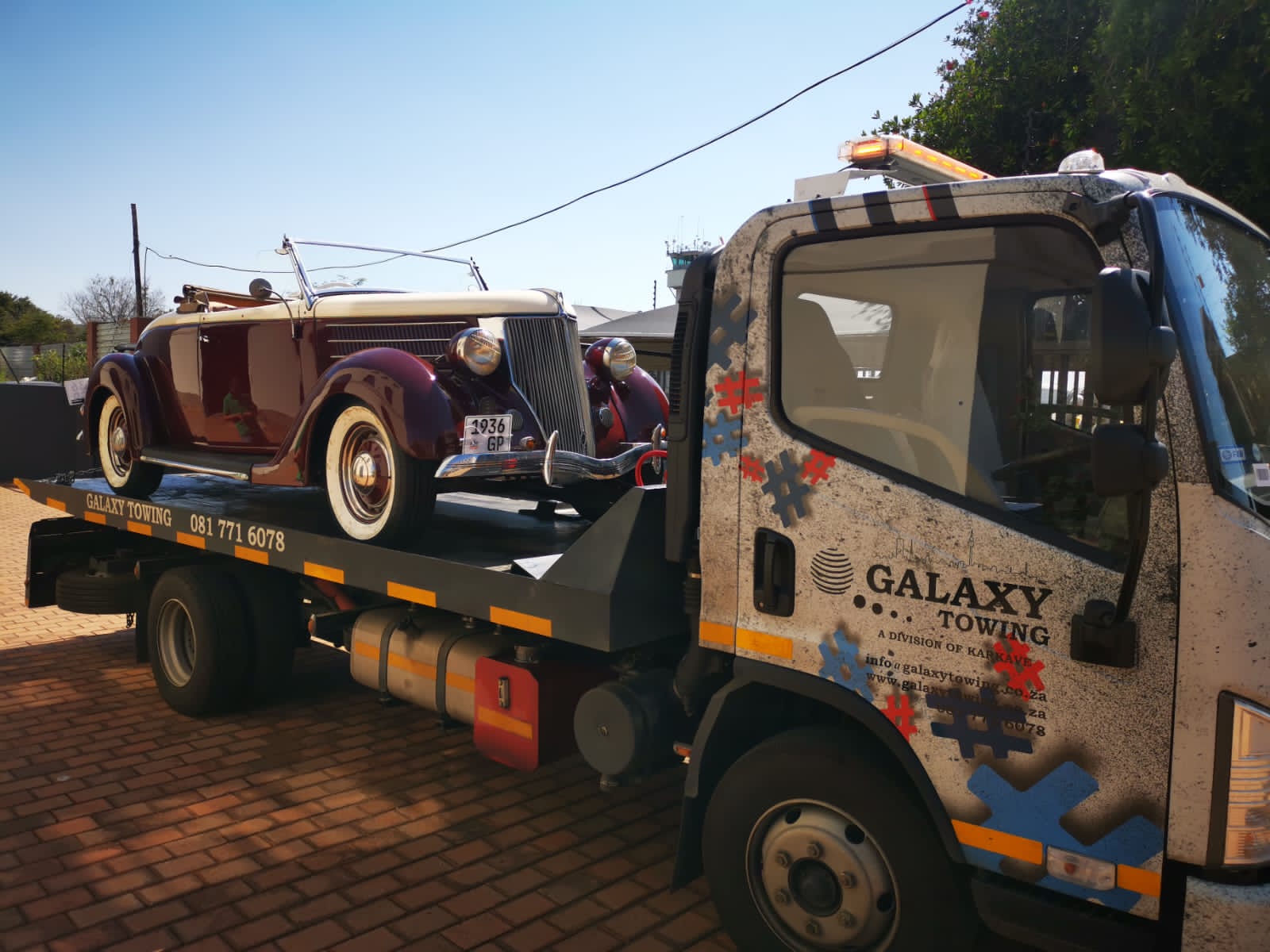 Galaxy Towing flatbed with a BMW M3 performance sedan