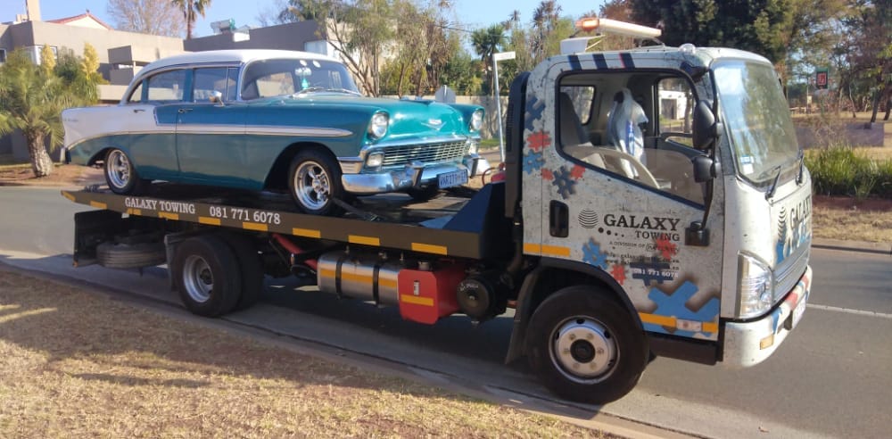 Galaxy Towing flatbed transporting a BMW M3 coupe